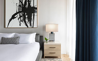 The Kimpton Pittman Hotel bed and side sidetable